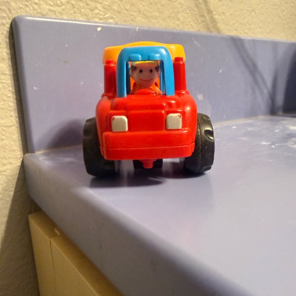 Red Kids Toy Truck with Yellow Canopy and Blue Accents